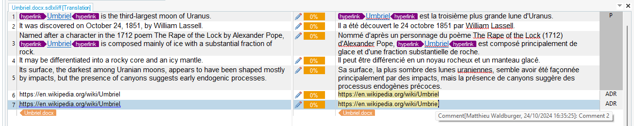 Screenshot of Trados Studio interface showing source and target translation segments for a text about Umbriel with a comment added to a URL.