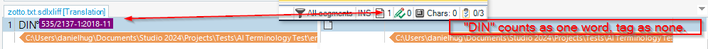 Screenshot of Trados Studio interface showing a segment with the text 'DIN 5352137-1:2018-11' highlighted in purple and a warning message indicating 'DIN' counts as one word, tag as none.