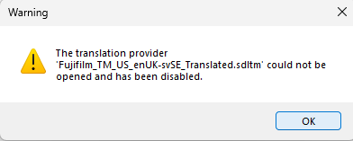 Warning dialog box in Trados Studio indicating 'The translation provider Fujifilm_TM_US_enUK-svSE_Translated.sdltm could not be opened and has been disabled.'