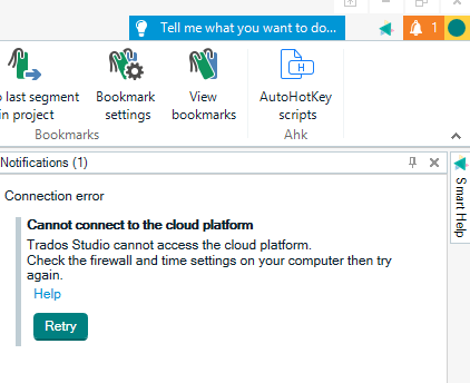 Trados Studio interface showing a notification with a connection error message: 'Cannot connect to the cloud platform. Check the firewall and time settings on your computer then try again.' Options include 'Help' and 'Retry.'