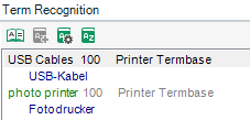 Term Recognition window showing 'USB Cables' and 'photo printer' without separate synonyms, with their German translations 'USB-Kabel' and 'Fotodrucker' respectively, each with a score of 100 from 'Printer Termbase'.