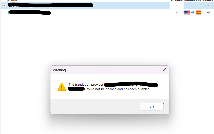 Warning pop-up in Trados Studio stating that the translation provider could not be opened and has been disabled.