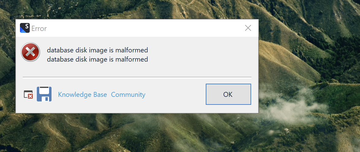 Error message in Trados Studio 2022 stating 'database disk image is malformed' with an OK button and links to Knowledge Base and Community.
