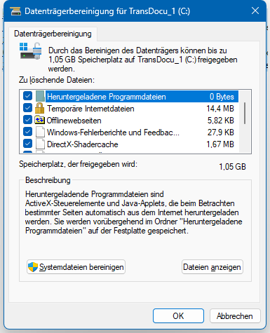 Disk Cleanup utility window for drive C: showing potential files to delete such as Temporary Internet Files, Temporary Files, Offline Webpages, and others. A total of up to 1.05 GB can be freed. The 'Clean up system files' button is at the bottom.