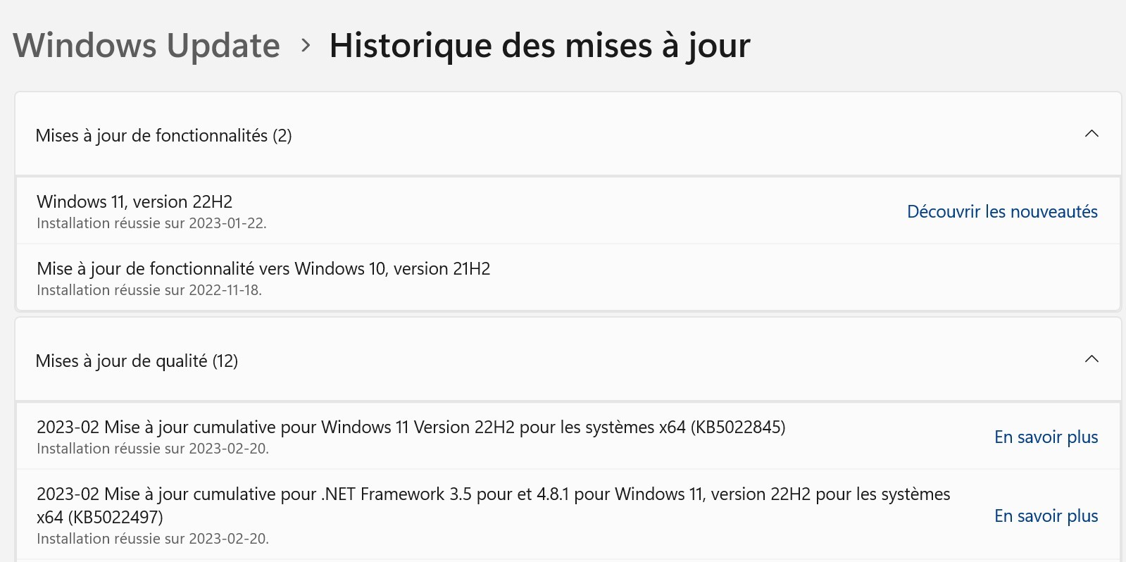Screenshot of Windows Update history showing successful installation of Windows 11, version 22H2 on 2023-01-22 and a feature update to Windows 10, version 21H2 on 2022-11-18.