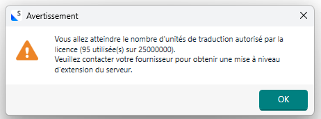 Warning popup in French indicating nearing the limit of translation units allowed by the license, with 95 used out of 2500000, and advising to contact the provider for a server extension update.