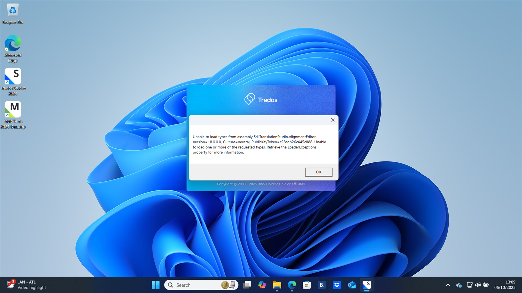 Windows 11 desktop with a Trados error message stating 'Unable to load types from assembly Sdl.TranslationStudio.AlignmentEditor. Version=18.0.0.0. Culture=neutral. PublicKeyToken=C28cdb26c445c888. Unable to load one or more of the requested types. Retrieve the LoaderExceptions property for more information.' The error message is displayed in a dialog box with an 'OK' button.