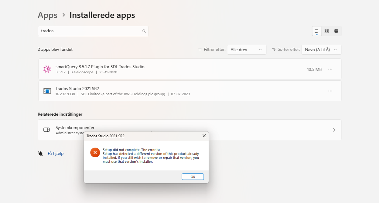 Screenshot of installed apps in a software interface showing two applications: 'smartQuery 3.5.1.7 Plugin for SDL Trados Studio' and 'Trados Studio 2021 SR2'. An error message overlay reads 'Setup did not complete. The error is: Setup has detected a different version of this product already installed. If you still wish to remove or repair that version, you must use that version's installer.' with an OK button.