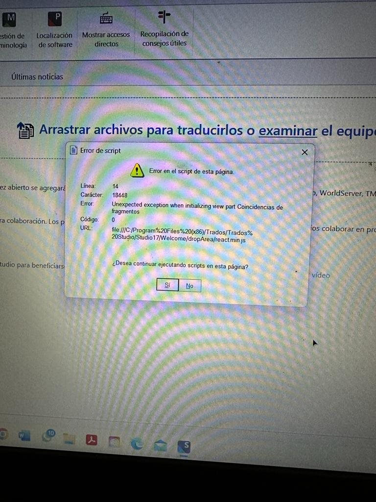 Screenshot of Trados Studio error message. It reads 'Error de script' with details 'Line: 14, Character: 18448, Error: Unexpected exception when initializing view part Coincidencias de fragmentos, Code: 0, URL: file:C:Program%20Files%20(x86)TradosTrados%20StudioStudio17WelcomedropAreareact.min.js'. Options to continue or stop scripts are provided.
