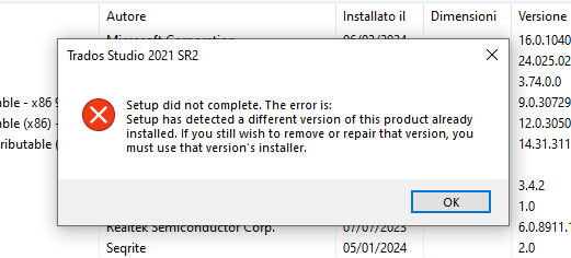 Error message during Trados Studio 2021 SR2 uninstallation stating 'Setup did not complete. The error is: Setup has detected a different version of this product already installed.' with an OK button.