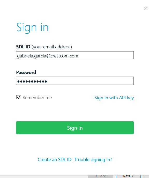 Screenshot of a sign-in page with fields for SDL ID and Password filled in. Options to 'Remember me', 'Sign in with API key', and links for creating an SDL ID or troubleshooting sign-in issues are visible.