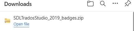 Downloads bar showing 'SDLTradosStudio_2019_badges.zip' with an option to 'Open file'.