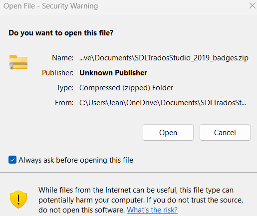 Security warning dialog for 'SDLTradosStudio_2019_badges.zip' from an unknown publisher, with options to 'Open' or 'Cancel' and a warning about potential harm from the file.