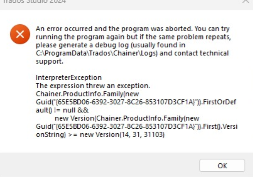 Error message in Trados Studio 2024 software indicating a program abortion due to an error, with instructions to run the program again or generate a debug log for technical support.