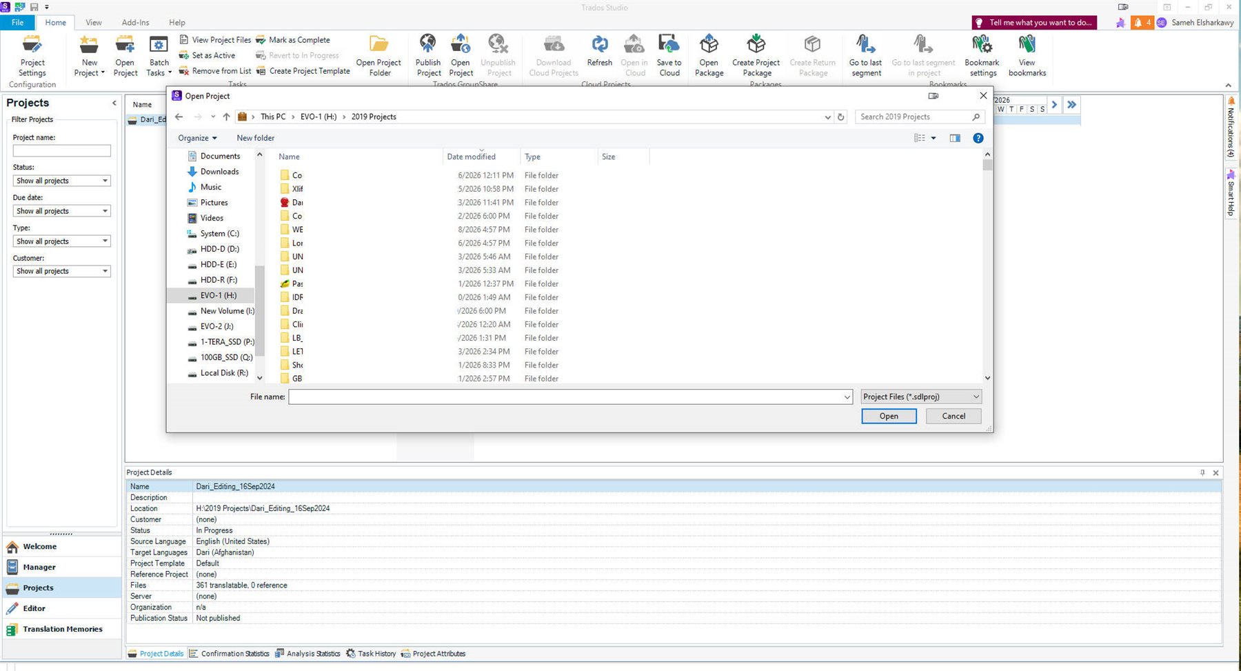 Screenshot of Trados Studio showing the Open Project interface with a standard Windows file picker, displaying folders and a dropdown for selecting .sdlproj files.