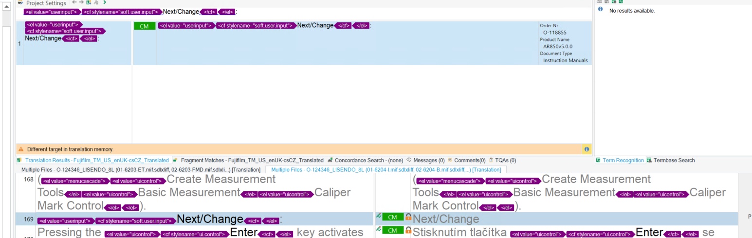 Screenshot of Trados Studio showing a segment with a warning 'Different target in translation memory.' The segment is locked and marked as CM, despite having different entries from the TM.