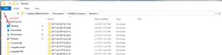 Windows Explorer window open at the 'Versions' directory with multiple subfolders listed, and an arrow pointing to the 'Up' navigation button.