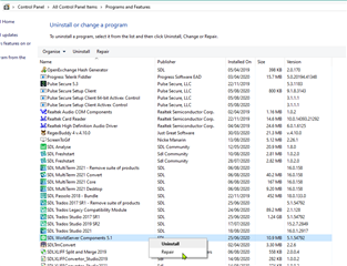 Control Panel with a list of installed programs, highlighting the option to repair WorldServer Components for Trados Studio.