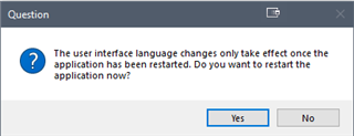 Dialog box in Trados Studio asking if the user wants to restart the application now for the user interface language changes to take effect, with 'Yes' and 'No' options.