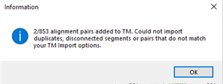 Information dialog box in Trados Studio showing a message that 2 out of 853 alignment pairs were added to TM and could not import duplicates, disconnected segments, or pairs that do not match TM import options.