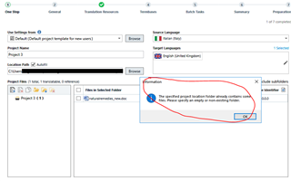 Trados Studio error message saying 'The specified project location folder already contains some files. Please specify an empty or non-existing folder.' with an OK button.