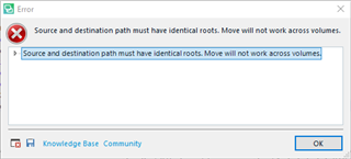 Error message in Trados Studio stating 'Source and destination path must have identical roots. Move will not work across volumes.' with an OK button.