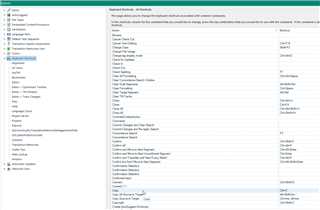 Trados Studio screenshot showing the 'Options' menu with 'Keyboard Shortcuts' highlighted, displaying a list of commands and their corresponding shortcuts.