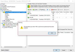 Trados Studio Project Settings window showing a warning message that the translation provider 'TM' could not be opened and has been disabled.