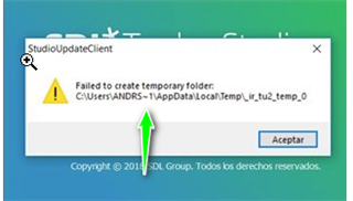 Error message in Trados StudioUpdateClient saying 'Failed to create temporary folder' with file path 'C:UsersANDRS~1AppDataLocalTemp~lr_tu2_temp_0'. Green arrow pointing to the tilde in the file path. Accept button at the bottom.