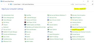 Control Panel window set to 'Small icons' view with 'Programs and Features' highlighted among other system settings.