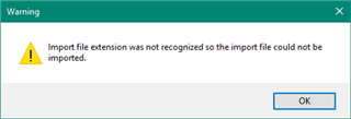 Warning message in Trados Studio stating 'Import file extension was not recognized so the import file could not be imported.' with an OK button.