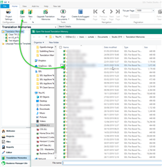 Trados Studio screenshot showing the Translation Memories view with a list of TMs. A green arrow points to the 'Add' button indicating the action to add a TM to the project.