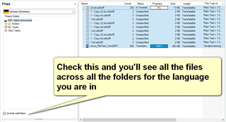 Trados Studio screenshot showing the 'Files' view with a list of files and folders. A yellow arrow points to a checkbox with a tooltip saying 'Check this and you'll see all the files across all the folders for the language you are in'.