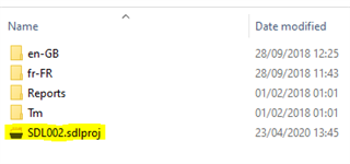 Windows Explorer showing a folder with subfolders 'en-GB', 'fr-FR', 'Reports', 'Tm', and a file 'SDL002.sdlproj' with a modified date.