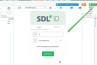 Screenshot of SDL Trados Studio login page with a green arrow pointing to the login button.