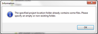 Information dialog box in Trados Studio warning that the specified project location folder already contains some files and asks to specify an empty or non-existing folder.