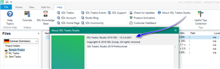 Trados Studio application window showing the 'Help' tab expanded with an arrow pointing to 'Check for Updates'. The version number 15.2.7.2849 is visible in the 'About SDL Trados Studio' pop-up.