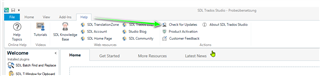 SDL Trados Studio application with an arrow pointing to the 'Check for Updates' option in the Help menu.
