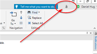 Trados Studio interface showing a notification bell icon highlighted in orange, indicating an update alert, with a red arrow pointing to it.