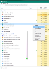 Windows Task Manager showing a list of applications and background processes with a context menu open to end a Trados Studio related process.