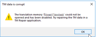 Error message in Trados Studio 2021 stating 'TM data is corrupt. The translation memory name blurred could not be opened and has been disabled. Try repairing the TM data in a TM Repair application.' with an OK button.