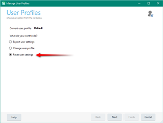 Trados Studio Manage User Profiles window with 'Reset user settings' option selected, indicated by a red arrow.