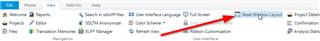 Trados Studio screenshot showing the menu bar with an arrow pointing to the 'Reset Window Layout' option.