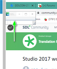 Trados Studio icon visible in the taskbar with an arrow pointing to it, indicating the program may be off-screen or minimized.