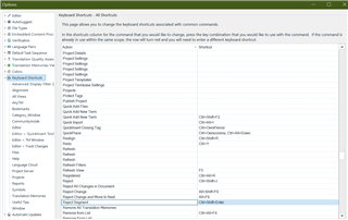 Screenshot of Trados Studio options menu showing 'Keyboard Shortcuts - Default' list with 'Reject Segment' command highlighted and assigned shortcut Ctrl+Shift+Enter under 'Editor' category.