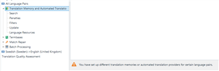 Trados Studio warning message at the bottom of 'All Language Pairs > Translation Memories' view stating 'You have set up different translation memories or automated translation providers for certain language pairs.'