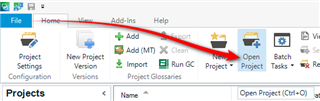 Trados Studio screenshot highlighting the Open Project icon on the toolbar with a red arrow.