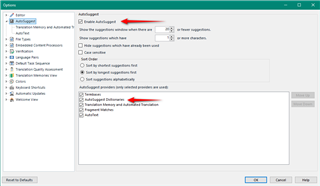 Trados Studio Options window showing AutoSuggest settings with an error message indicating 'AutoSuggest Dictionaries problems are visible'. Red arrows point to the error message and the unchecked 'Use AutoSuggest' option.