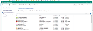 Control Panel's 'Programs and Features' window listing installed programs for potential removal.
