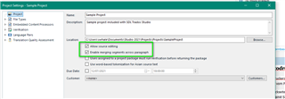 Trados Studio project settings window with 'Enable merging segments across paragraph' option highlighted in green.